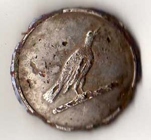 A button artefact depicting a raven from Arthurian legend and the Tales of the Mabinogion.